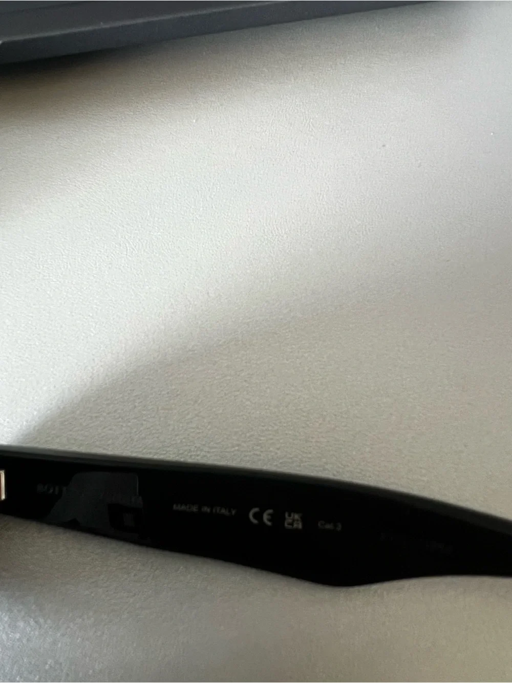 Bottega Veneta Black Oval Sunglasses with Dark Lenses